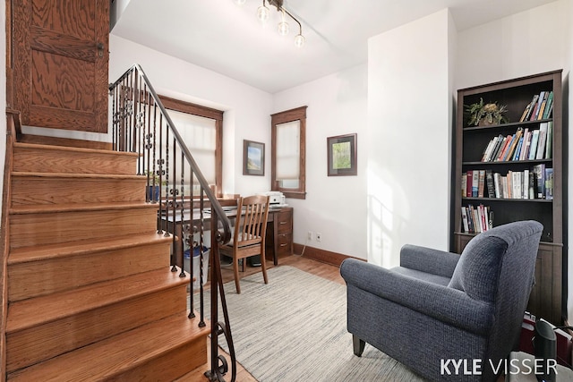 interior space with wood finished floors and baseboards