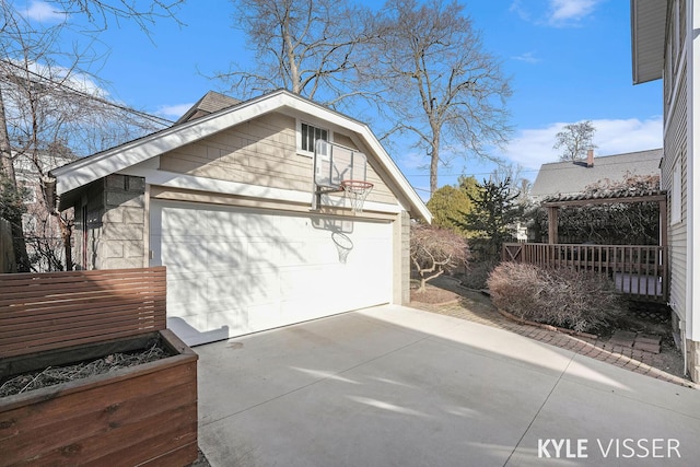 view of property exterior featuring a detached garage and an outdoor structure