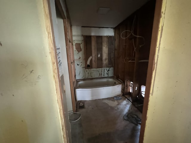 bathroom with a bathing tub and toilet