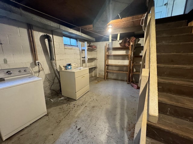 unfinished basement with washing machine and clothes dryer