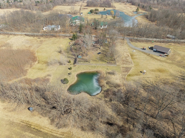 drone / aerial view featuring a rural view and a water view