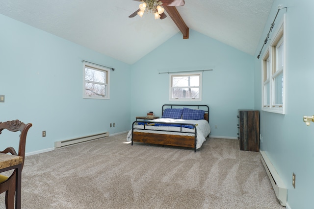 bedroom with multiple windows, a baseboard heating unit, and carpet floors