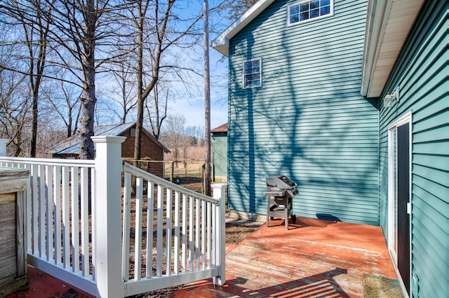 wooden deck with grilling area