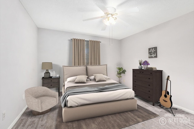 bedroom with carpet flooring, baseboards, and ceiling fan