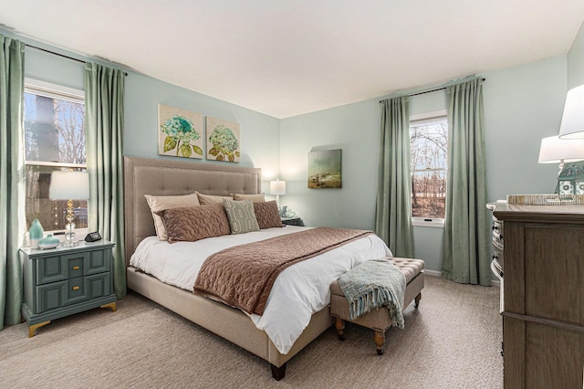 bedroom featuring light colored carpet