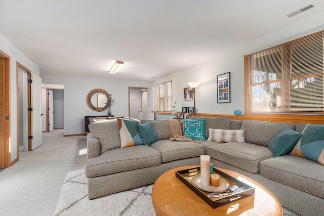 living room featuring visible vents and baseboards