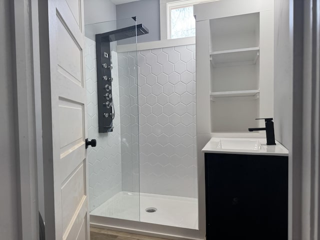 bathroom featuring vanity and a tile shower