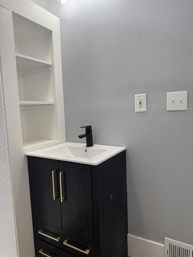 bathroom with visible vents and vanity