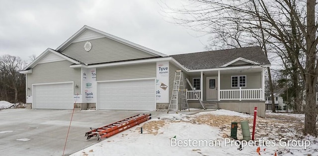 single story home with a porch and driveway