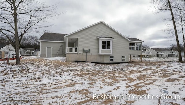 view of snow covered house