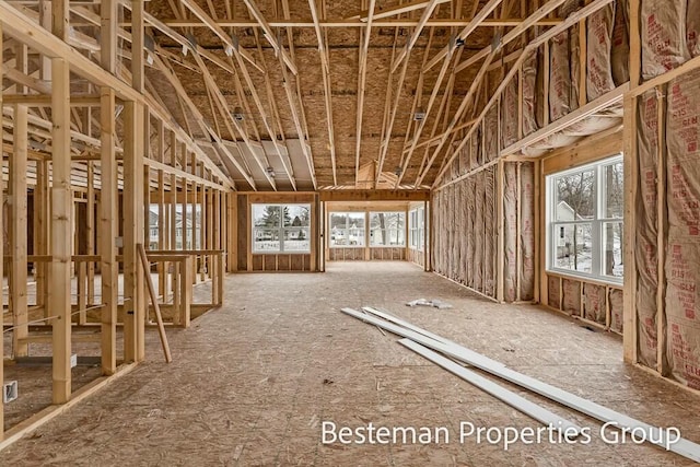 miscellaneous room with plenty of natural light and lofted ceiling