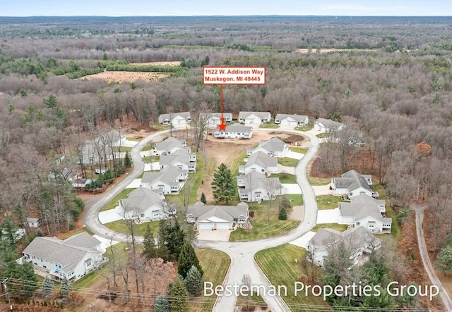 birds eye view of property featuring a residential view and a view of trees