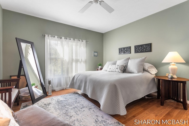 bedroom featuring a ceiling fan and wood finished floors