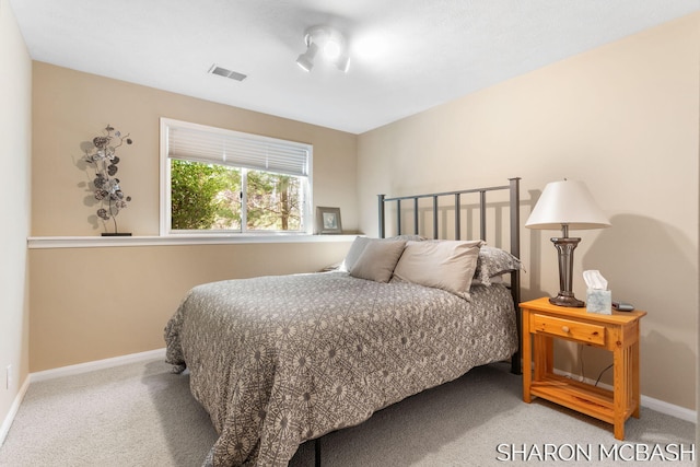 bedroom featuring carpet flooring, baseboards, and visible vents