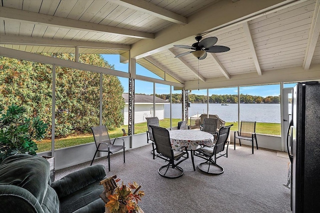 sunroom with wooden ceiling, vaulted ceiling with beams, ceiling fan, and a water view