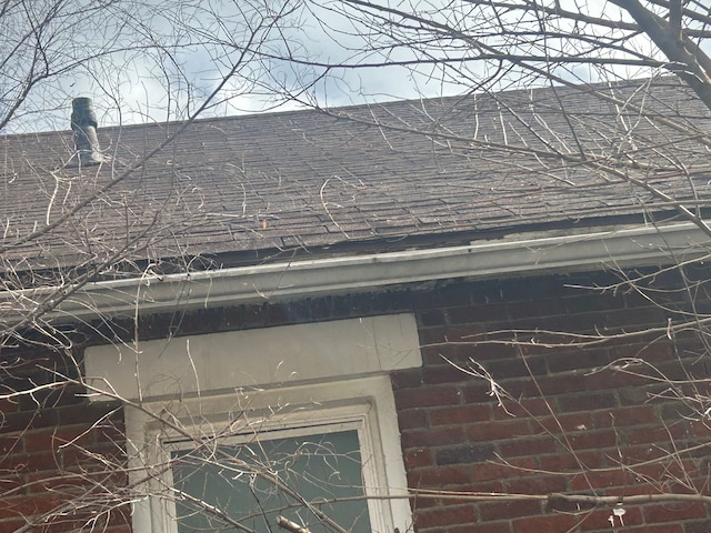 exterior details with a shingled roof