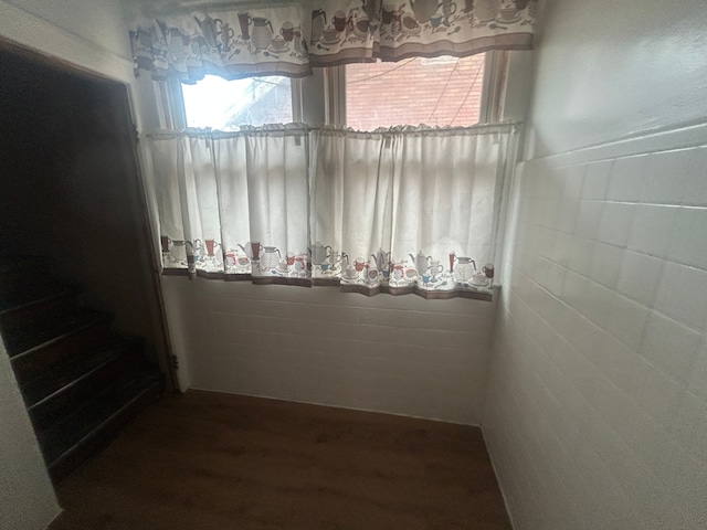 unfurnished dining area featuring wood finished floors