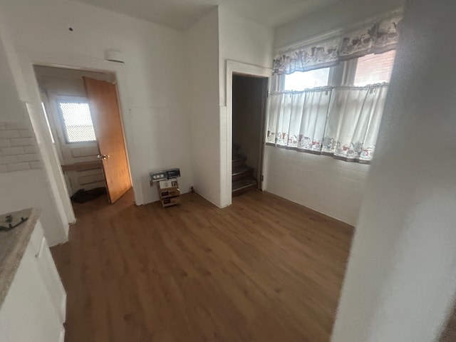 unfurnished bedroom featuring wood finished floors