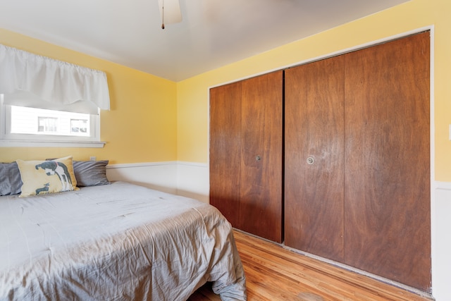 bedroom with a closet and light wood finished floors