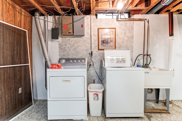 laundry room featuring washer and dryer, laundry area, and electric panel