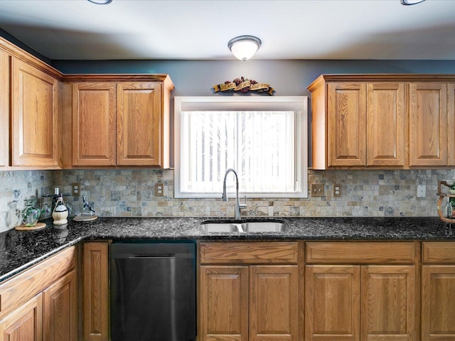 kitchen with dishwasher, decorative backsplash, brown cabinets, and a sink