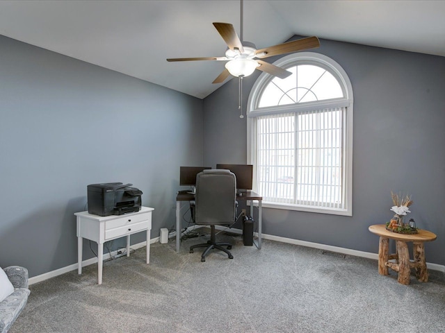 office area with vaulted ceiling, carpet flooring, baseboards, and ceiling fan