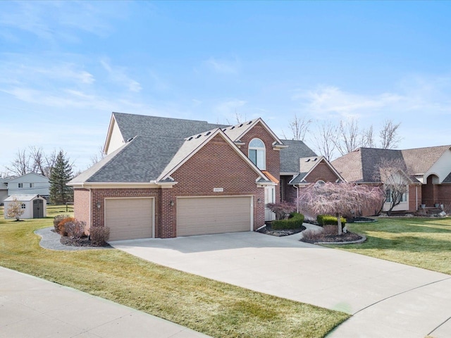 view of front of home featuring brick siding, an attached garage, a front lawn, a shed, and driveway