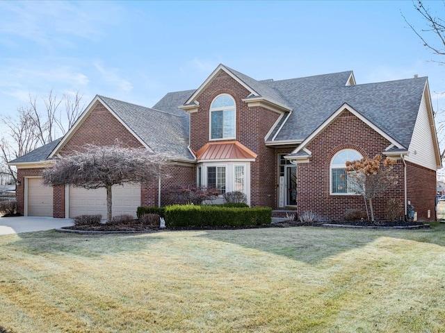 traditional home featuring a garage, brick siding, and a front yard