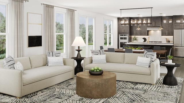 living room with plenty of natural light and light wood-style floors