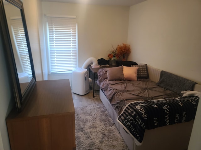 bedroom featuring light wood finished floors