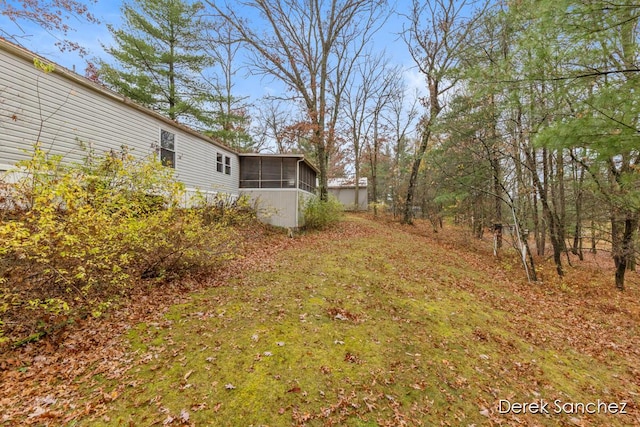 view of yard with a sunroom