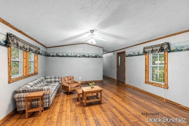 1872 E Shane Dr, Bitely, MI 49309 - living area with hardwood / wood-style floors, ornamental molding, a ceiling fan, a textured ceiling, and lofted ceiling