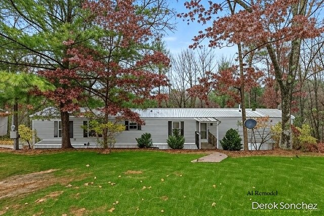 1872 E Shane Dr, Bitely, MI 49309 - view of front of property with a front lawn and a metal roof