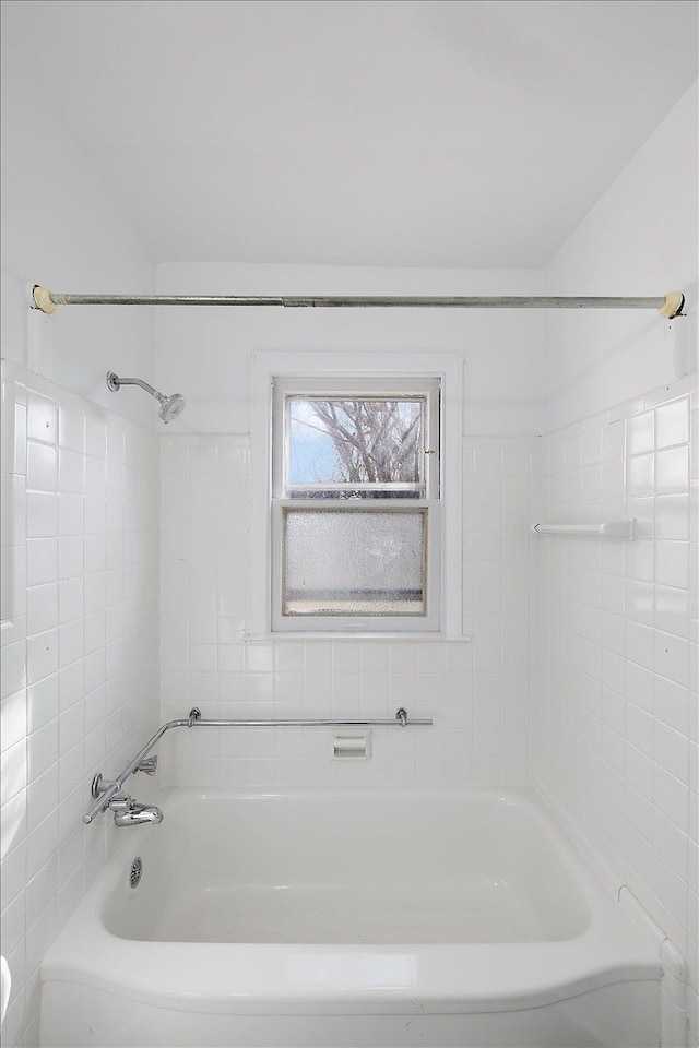 bathroom featuring washtub / shower combination