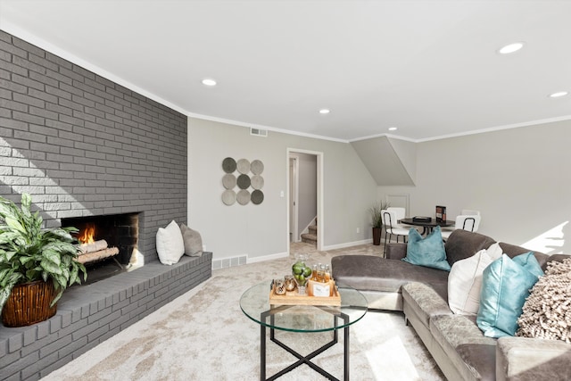 living room with visible vents, light colored carpet, a fireplace, and crown molding