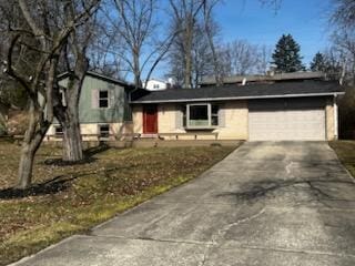 view of front of home featuring an attached garage and driveway