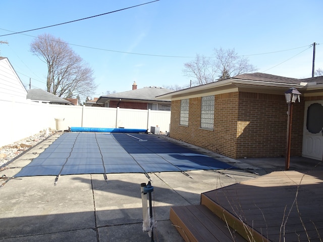 view of pool featuring a patio and a fenced backyard