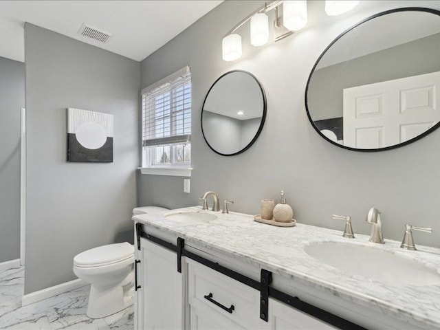 bathroom featuring a sink, visible vents, toilet, and marble finish floor