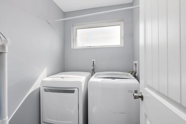 laundry room featuring laundry area and washer and clothes dryer