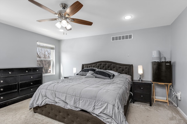 bedroom featuring visible vents, baseboards, carpet, and ceiling fan