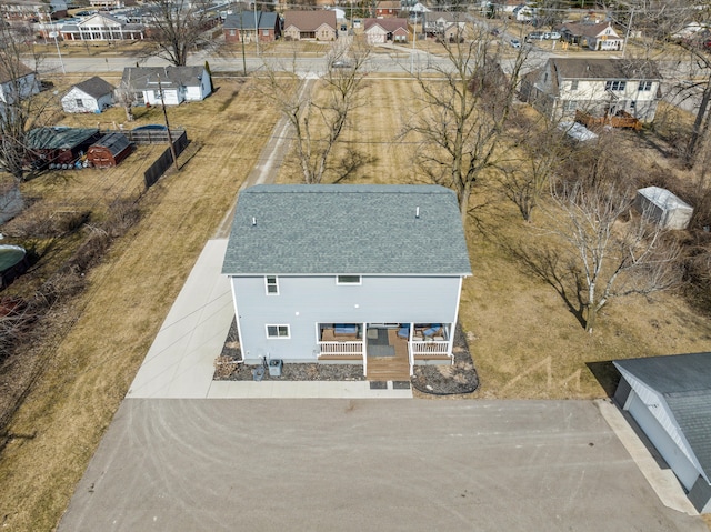 birds eye view of property with a residential view