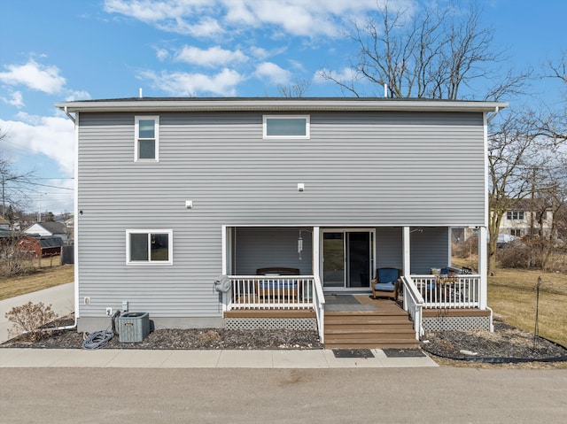 view of front of home featuring a porch and central AC