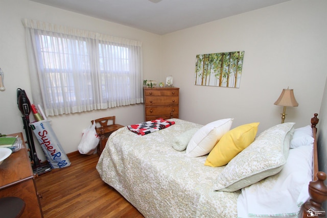 bedroom featuring wood finished floors