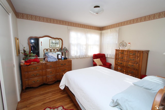 bedroom featuring wood finished floors