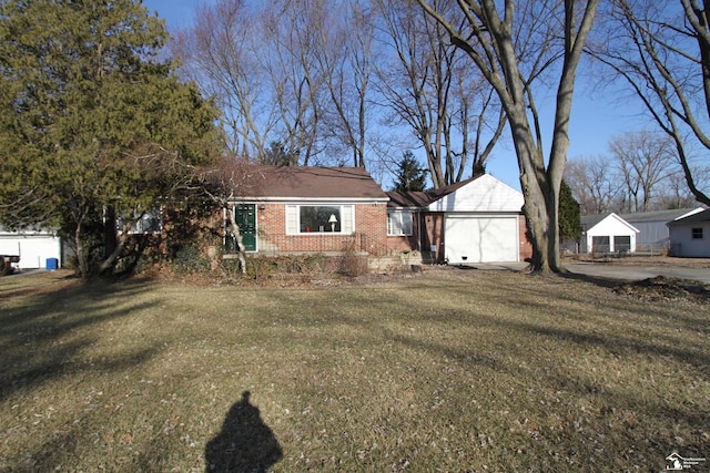 view of front of house featuring a front lawn and brick siding