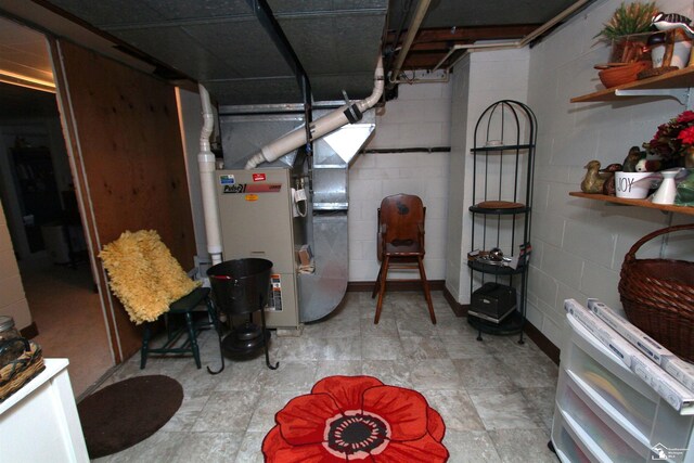 unfinished basement with concrete block wall