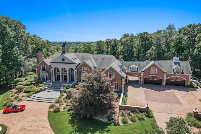 view of front of house with decorative driveway and a garage