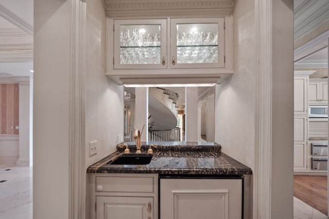 bar with a sink and wall oven