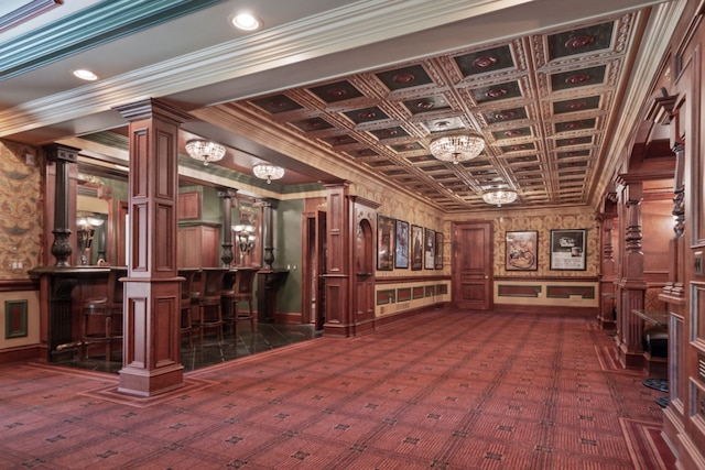 interior space featuring bar, an ornate ceiling, and ornamental molding