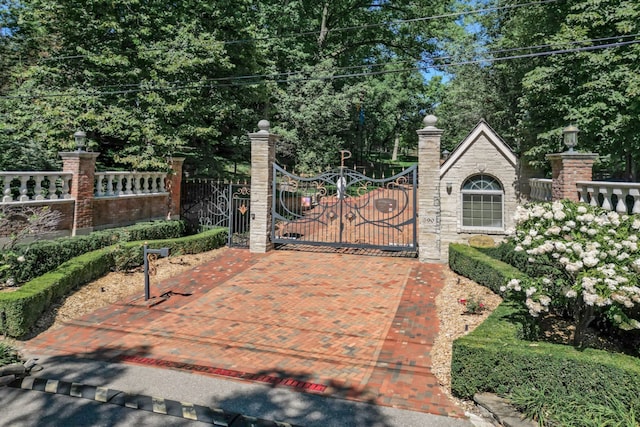 view of gate featuring fence